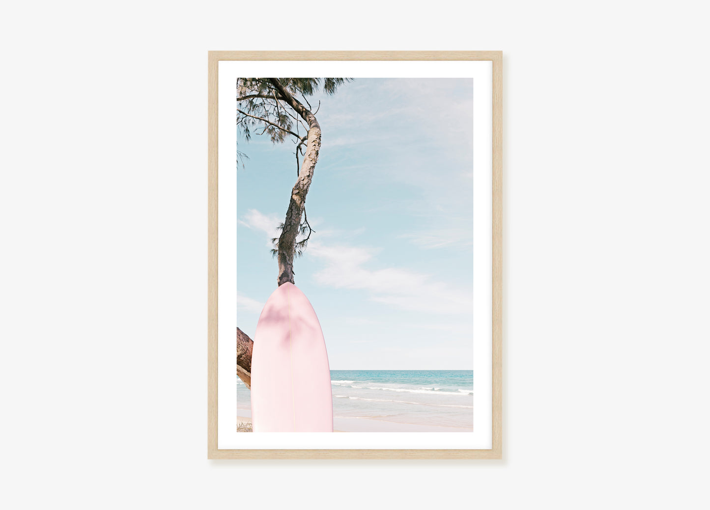 a picture of a pink surfboard on the beach